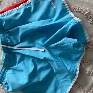 red white and light blue nike shorts